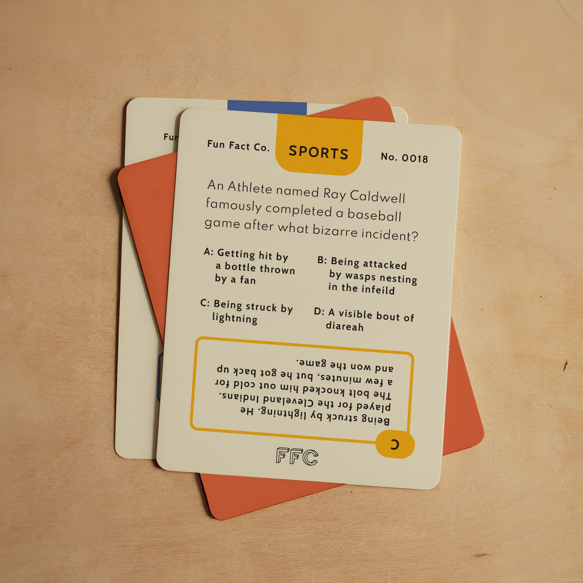 Card with sports trivia question on a wooden surface