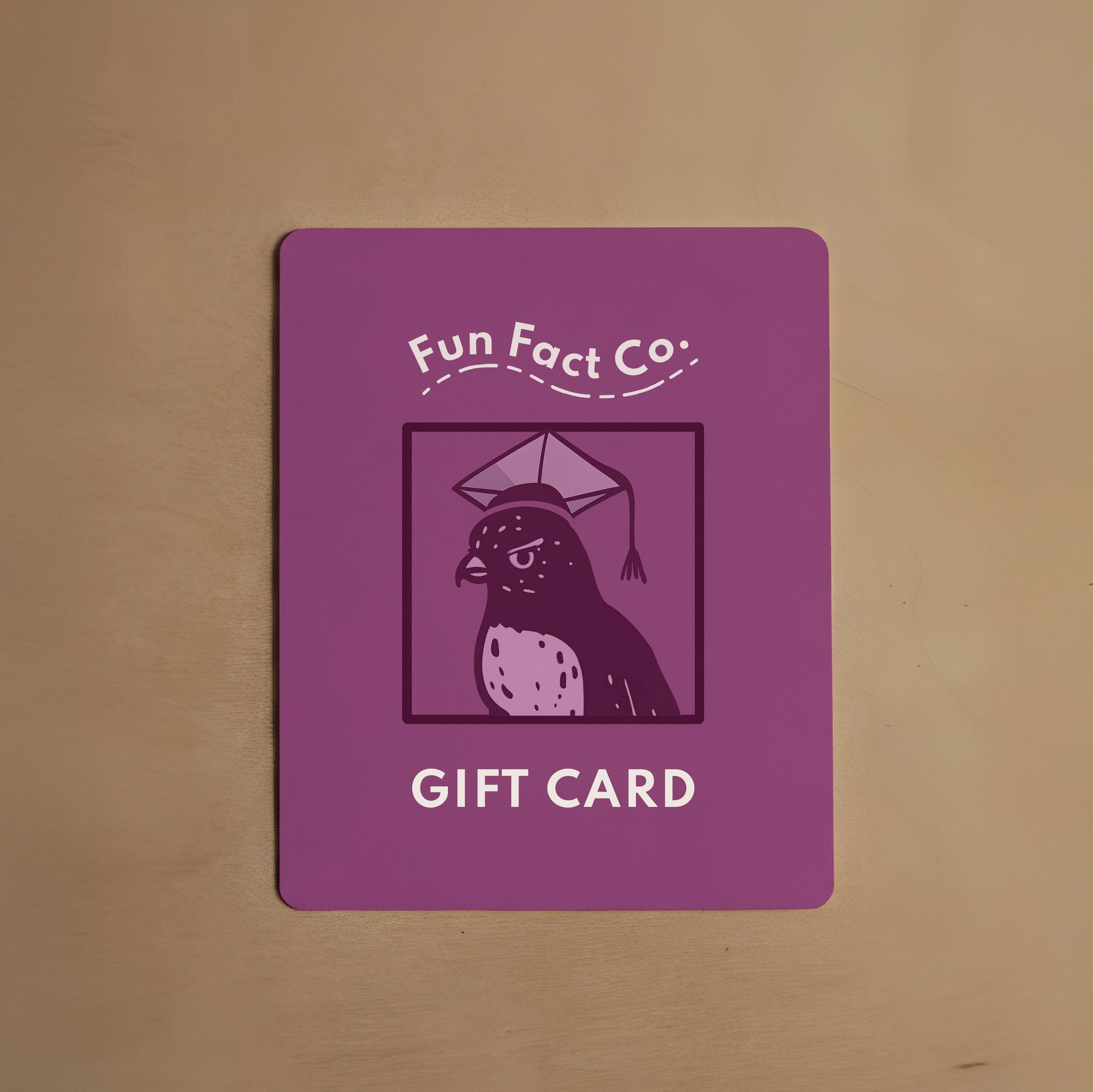Purple gift card with 'Fun Fact Co.' logo and a cat illustration on a brown background