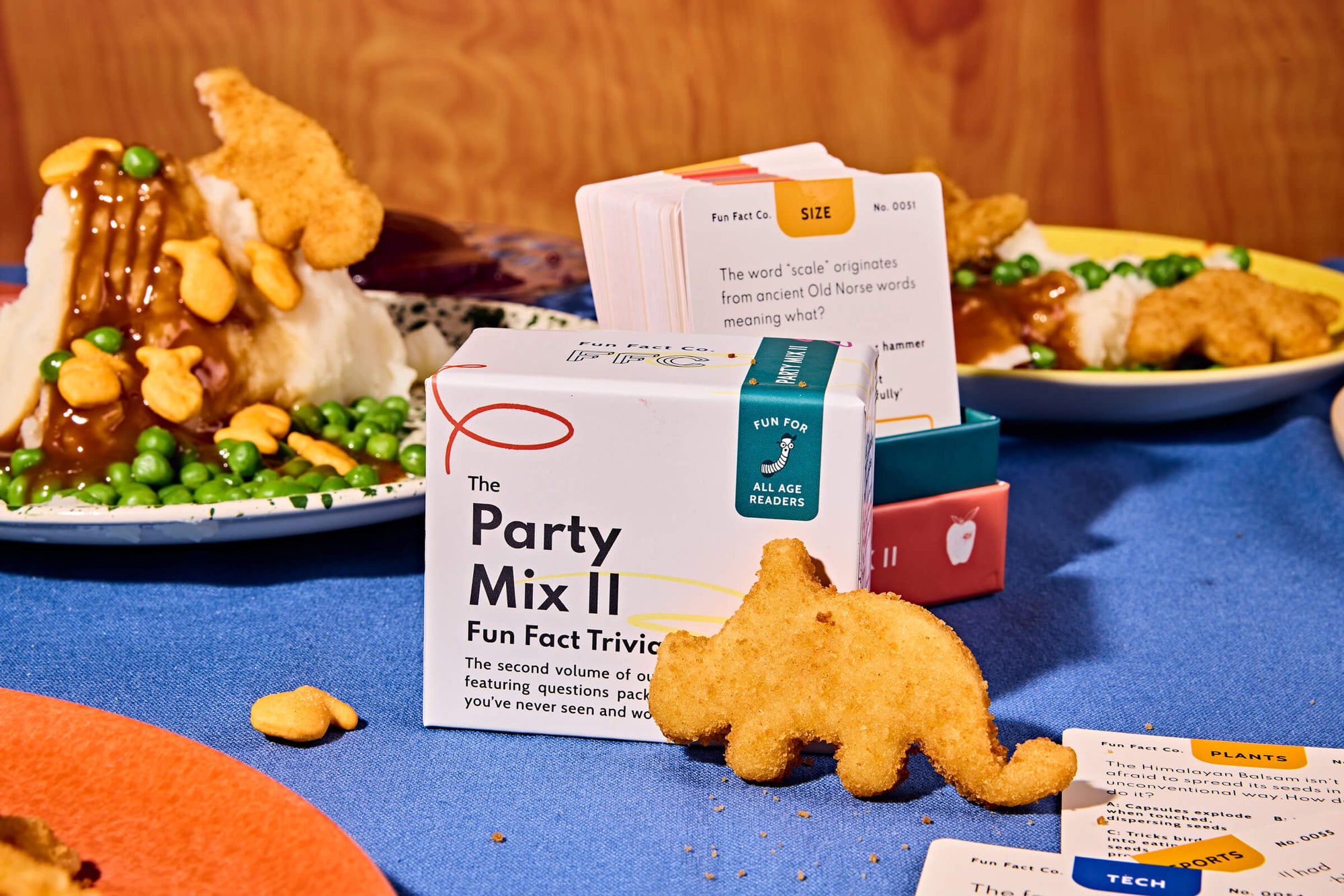 Box of 'The Party Mix II' with snack items on a table