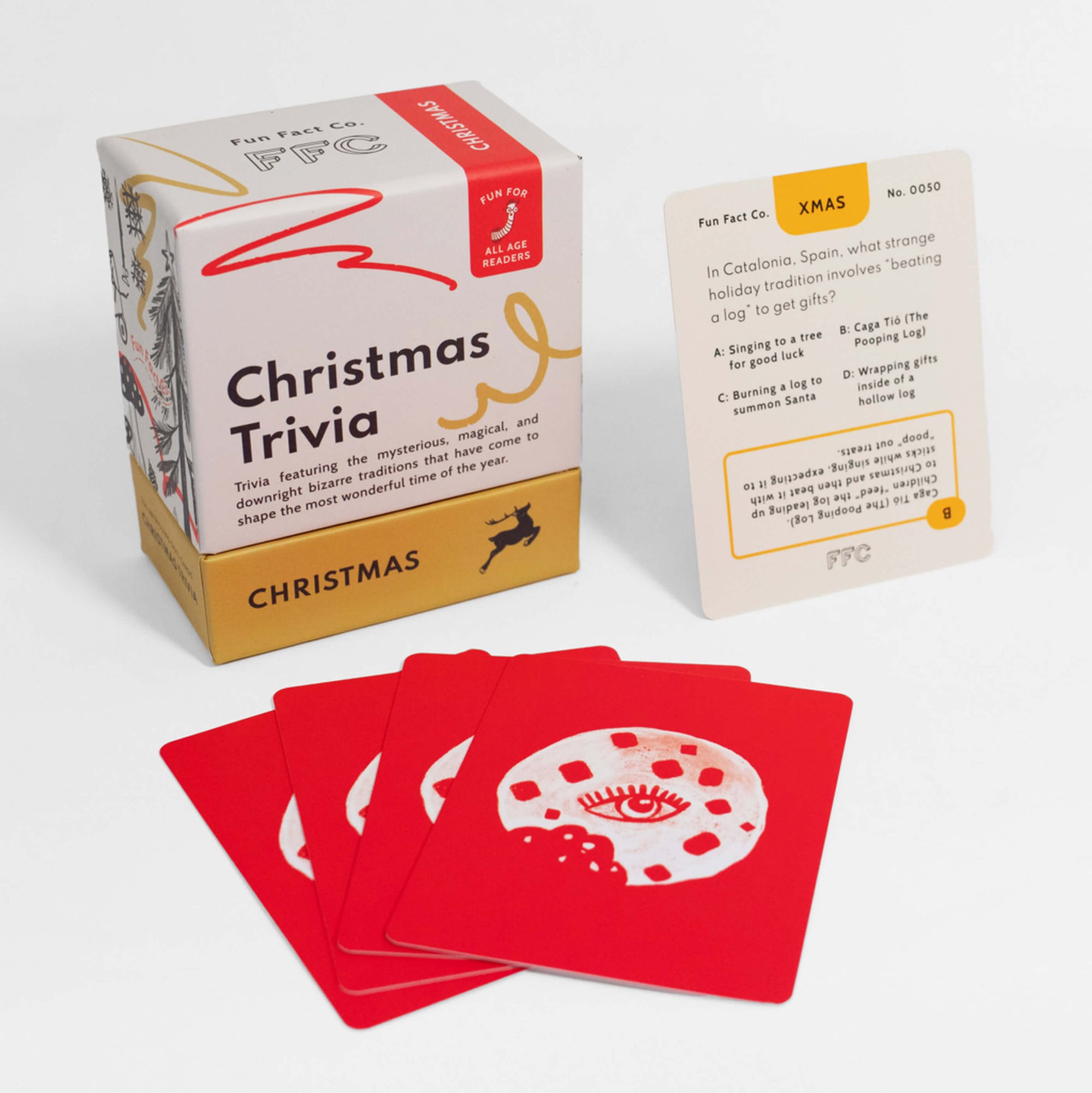 Christmas trivia game set with cards and packaging on a white background