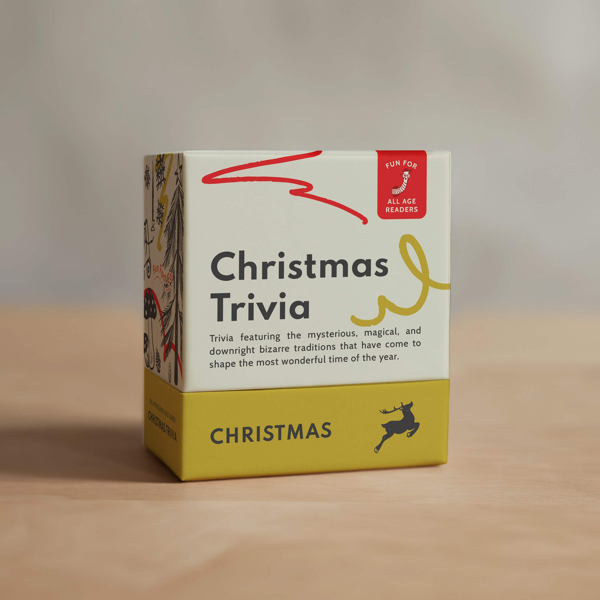 Box of Christmas Trivia game on a wooden surface with a neutral background